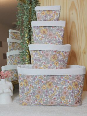 Lot de 4 panières ouvertes en tissu coton de tailles différentes, empilées les unes sur les autres.